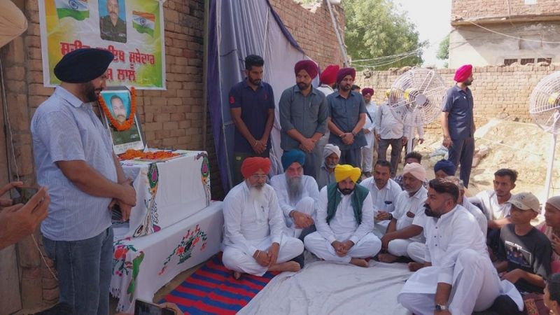Punjab CM Bhagwant Mann Shares Grief with Kin of Ramesh Lal, Naib Subedar who Martyred in Ladakh. Ramesh Lal hailed from Kotkapura in Punjab. CM Mann offered a cheque of Rs 1 Crore for the financial support of the family.
