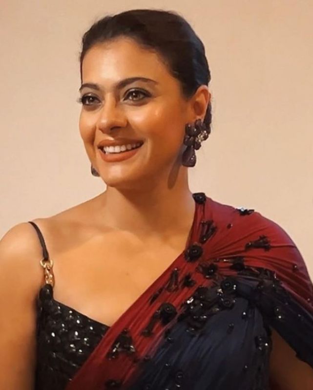 Kajol donned wine coloured saree with designer earrings 
