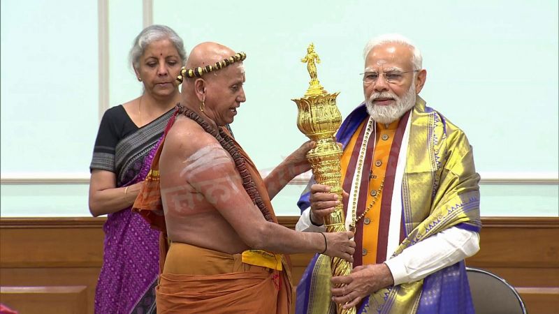 Chief Mahant of Madurai Adheenam Temple, Adheenam Harihar Das Swamigal hands over 'Sengol' to PM Modi which will be installed in the New Parliament Building  
