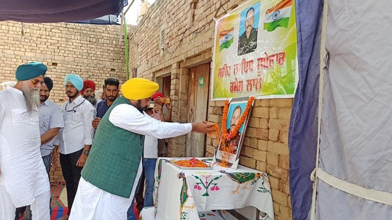 Punjab CM Bhagwant Mann Shares Grief with Kin of Ramesh Lal, Naib Subedar who Martyred in Ladakh. Ramesh Lal hailed from Kotkapura in Punjab. CM Mann offered a cheque of Rs 1 Crore for the financial support of the family.
