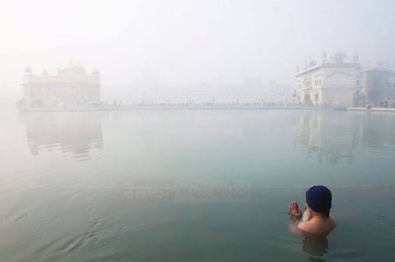Golden Temple Embraced by Fog Blanket, Unveiling a Serene Spectacle
