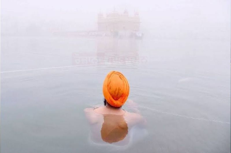Golden Temple Embraced by Fog Blanket, Unveiling a Serene Spectacle
